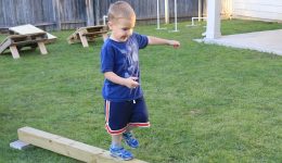 Child walking on a plank